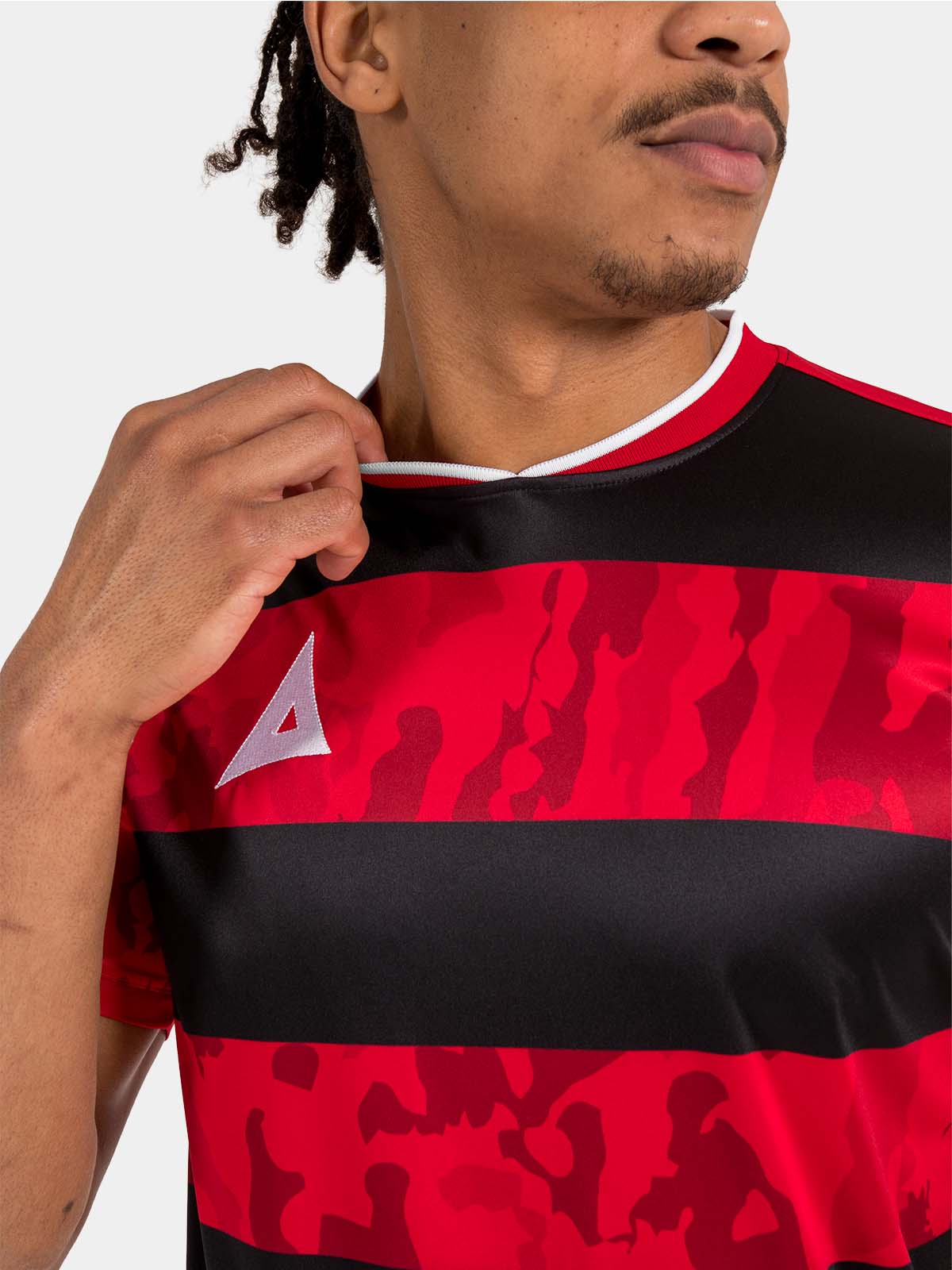interior neck detail of the red and black jersey, featuring the soft-feel label and durable ribbed neckline.