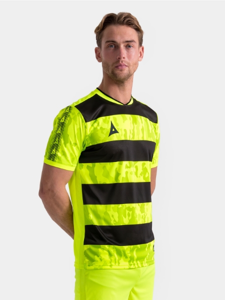 Model wearing the Neon Yellow and Black Pro Intent Jersey, highlighting the bold, high-energy matchday style.