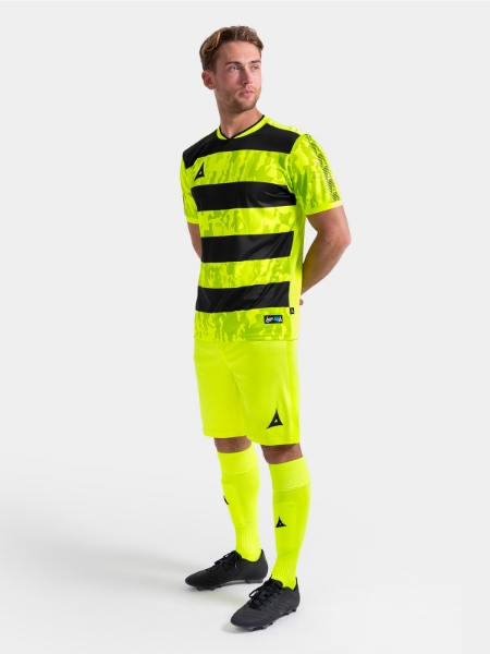 Full body shot of the Neon Yellow and Black Pro Intent kit, showing the high-visibility uniform on-model.