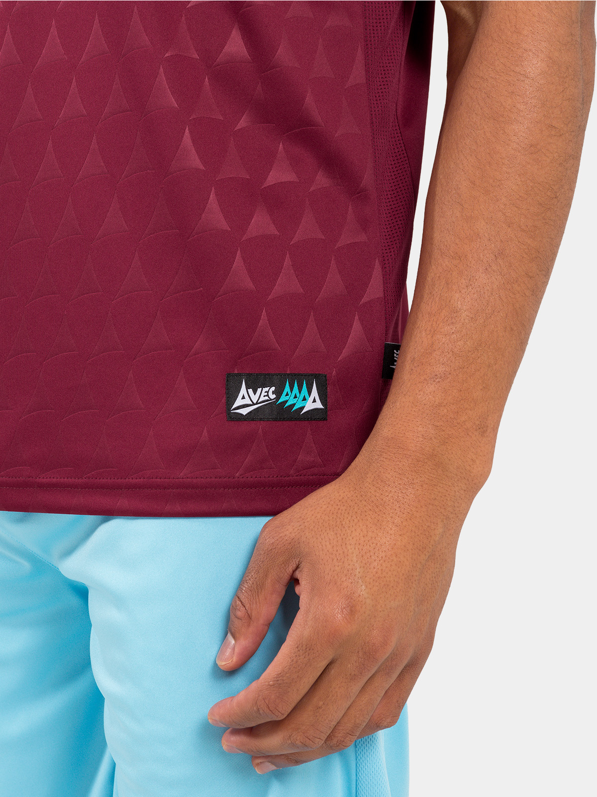 authentic hem label and mesh ventilation on the claret heritage matchday shirt.