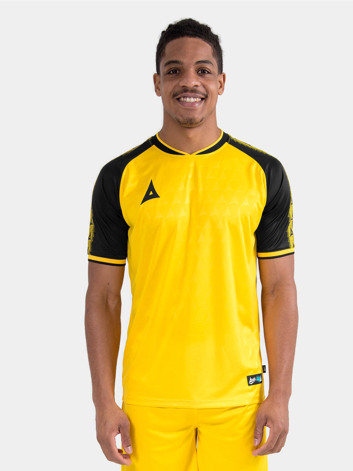 male model wearing the yellow and black heritage jersey, showcasing the professional matchday fit.