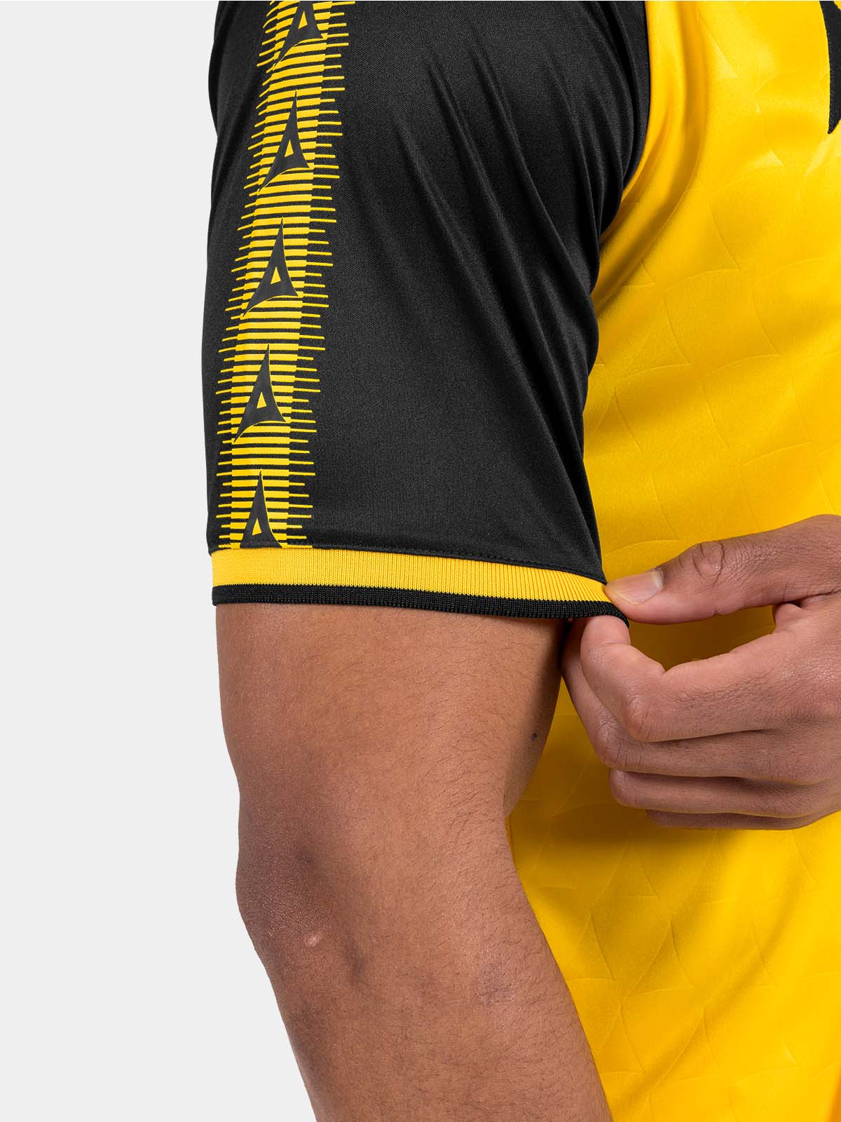 close-up of the yellow heritage sleeve featuring the iconic repeating avec 'a' branding.