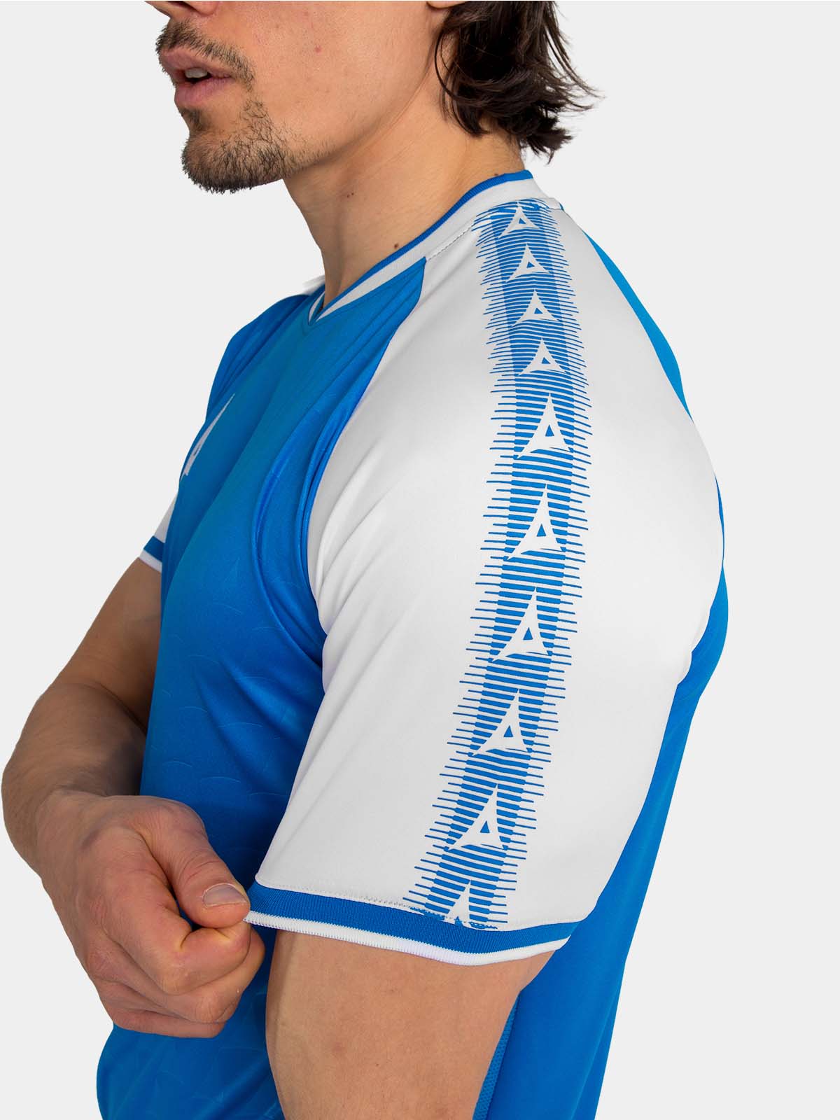 detail of the royal blue heritage shoulder branding and athletic sleeve cut.