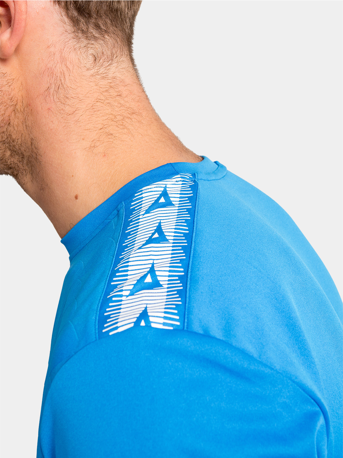 close-up of the royal blue shoulder, detailing the contrast white heritage 'a' logo tape
