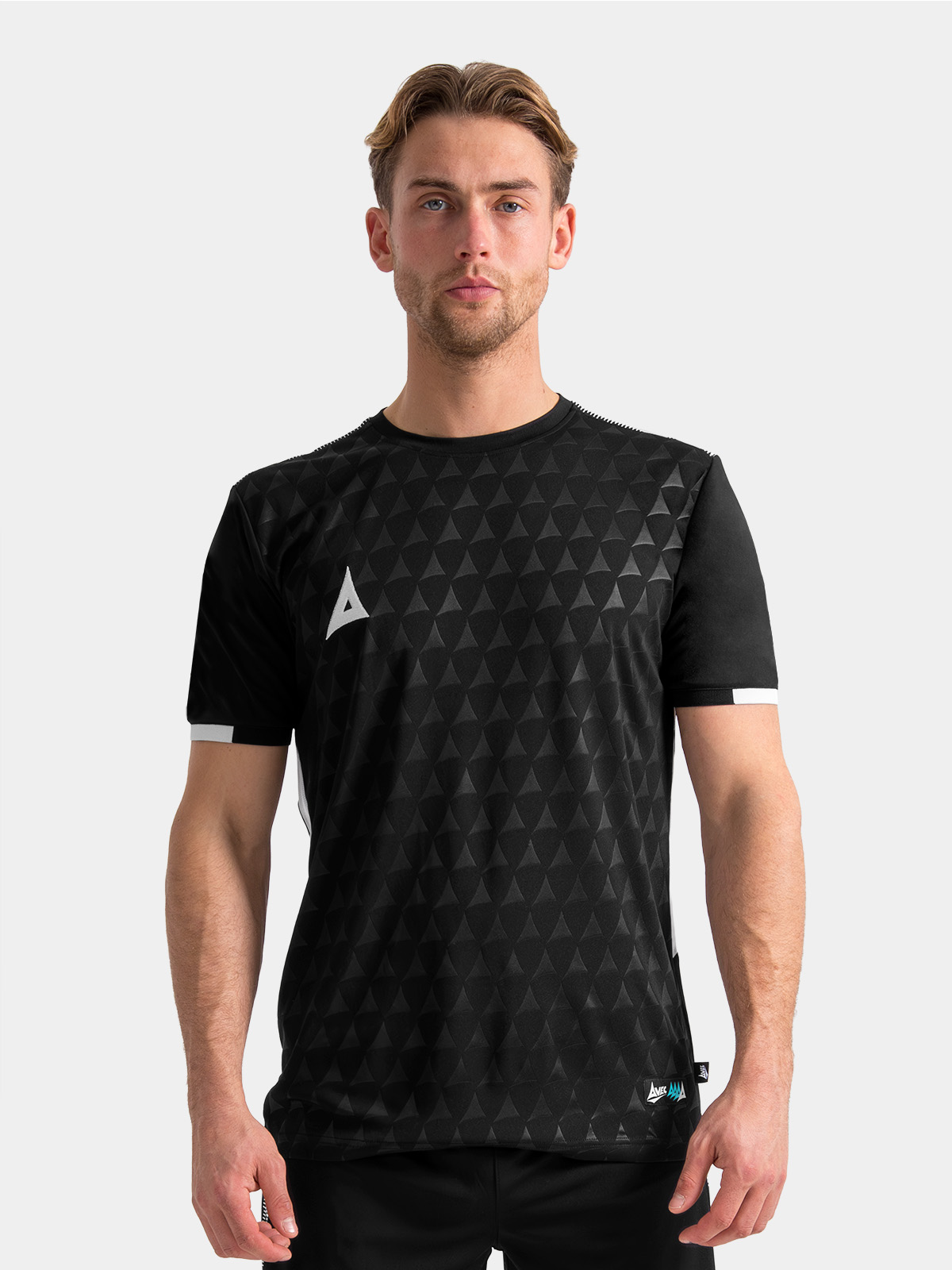 athlete wearing the black evolve pro training jersey, illustrating the performance-driven fit.