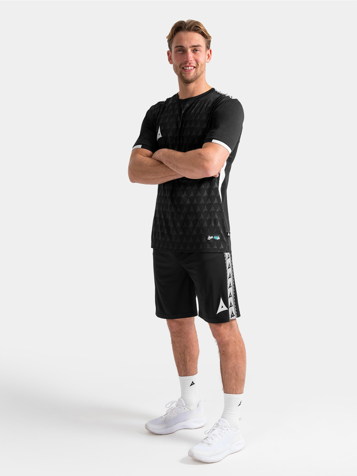 full training kit view featuring the black evolve pro top paired with matching training shorts and socks.