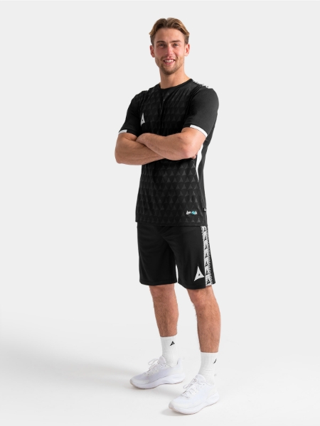 Full training kit view featuring the black Evolve Pro top paired with matching training shorts and socks.