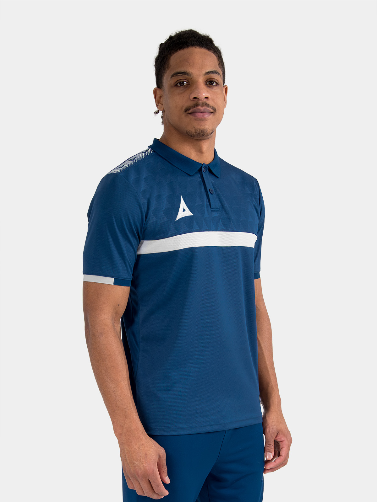 staff member in the navy evolve pro tech polo, demonstrating the smart sideline and travel fit.