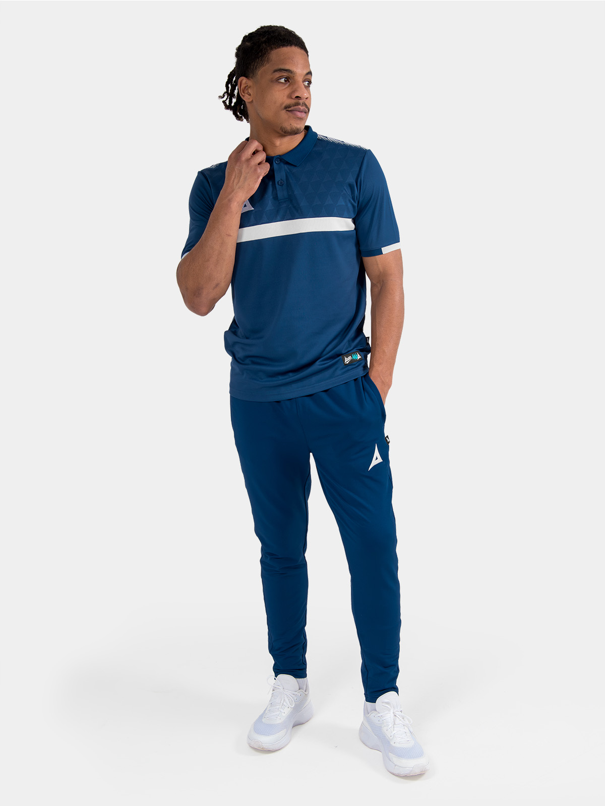 full-length view of the navy travel kit on-model, featuring the pro tech polo and presentation gear.