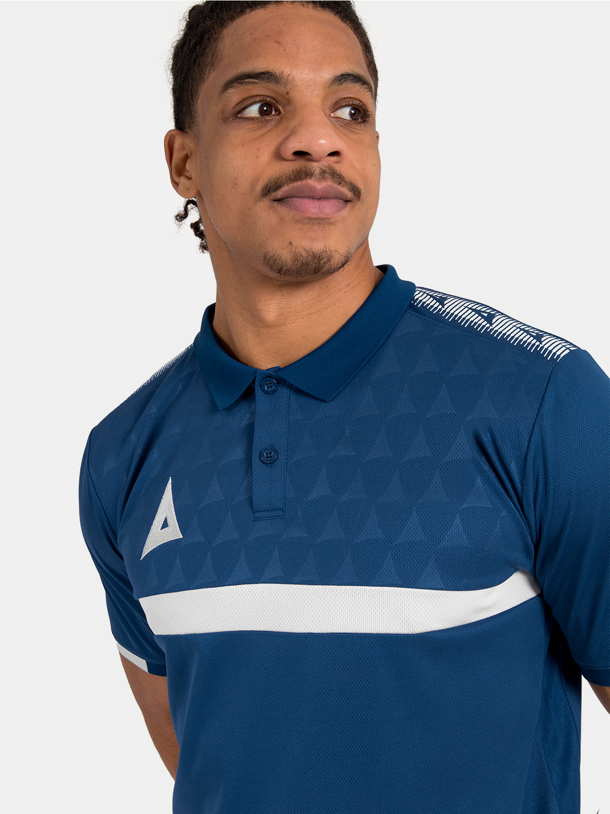 macro view of the subtle navy-on-navy debossed 'a' logo pattern throughout the front panel.