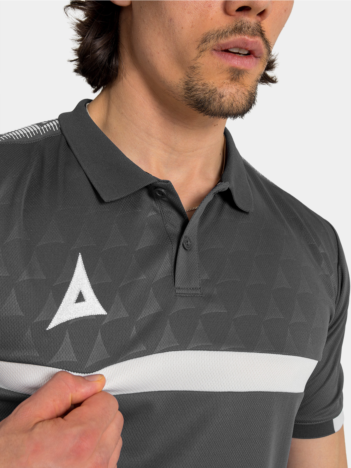 detailed perspective of the unique repeating debossed 'a' graphic on the charcoal front panel.