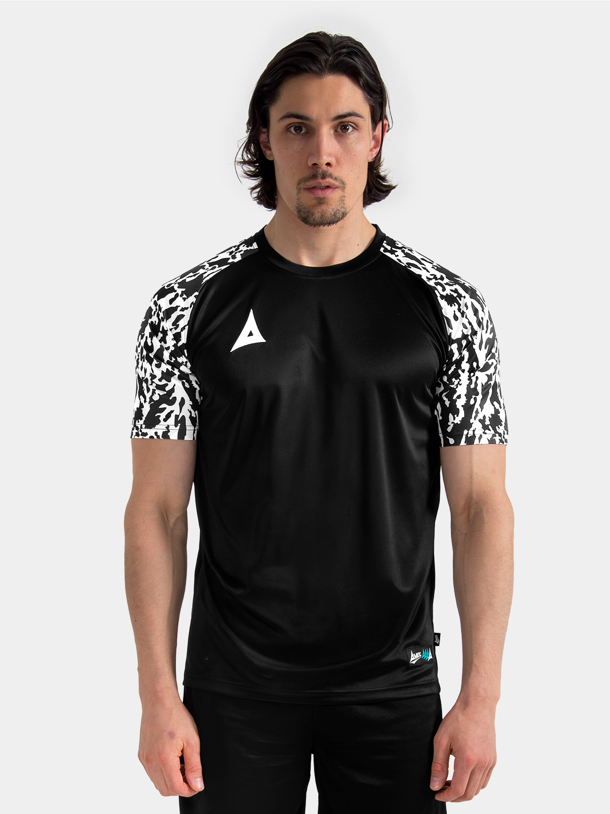 upper body view of a model wearing the black classic pro jersey, showcasing the true-to-size athletic cut.