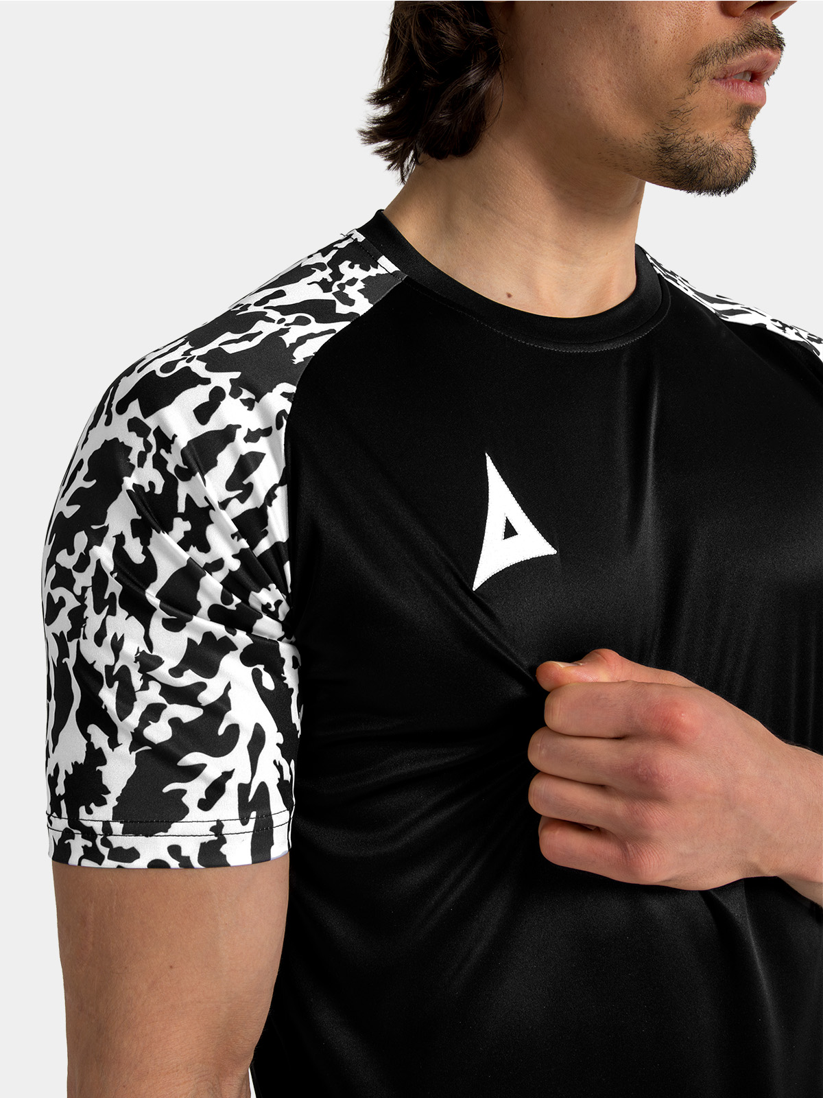 technical shot of the black ribbed round collar and reinforced neck tape.