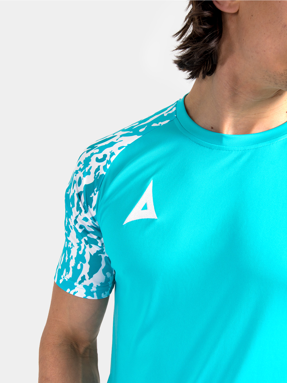 technical shot of the reinforced round neckline and soft-feel interior label on the hyper blue jersey.