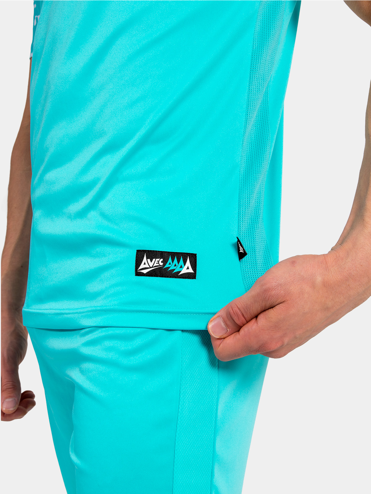 side seam detail of the hyper blue jersey, showing the high-performance mesh inserts and woven authentic id label.