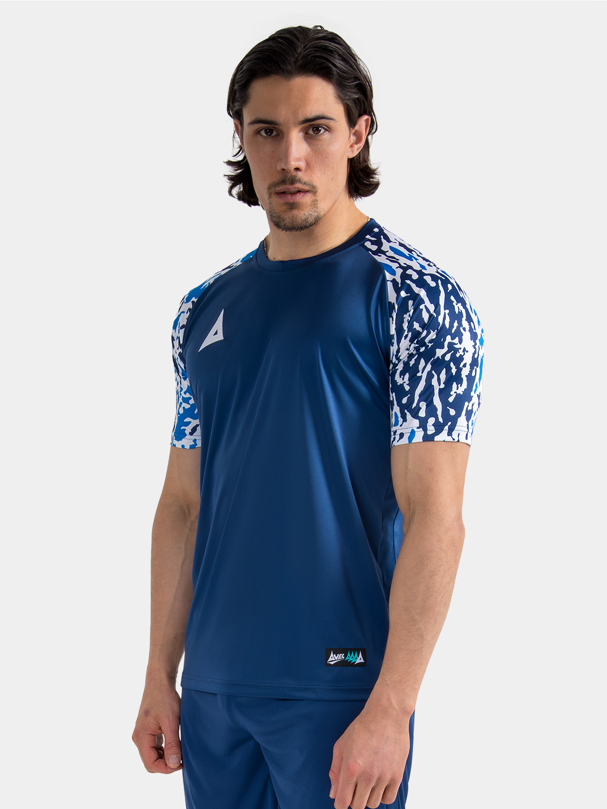 lifestyle shot of a model wearing the navy classic pro jersey, focusing on the comfortable athletic silhouette.