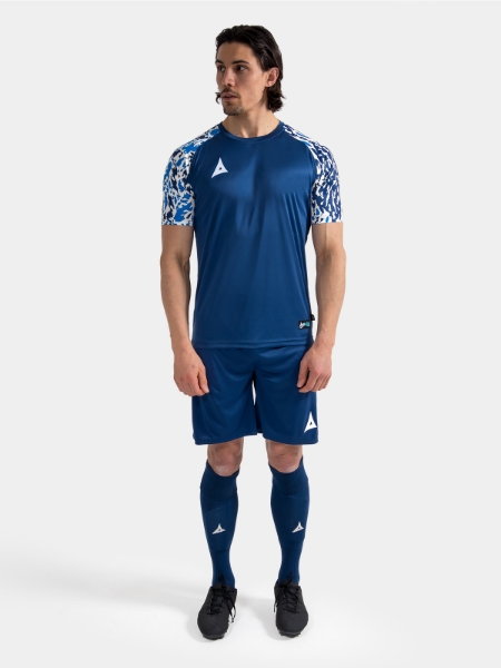 Complete Navy matchday kit on-model, demonstrating the elite on-pitch aesthetic