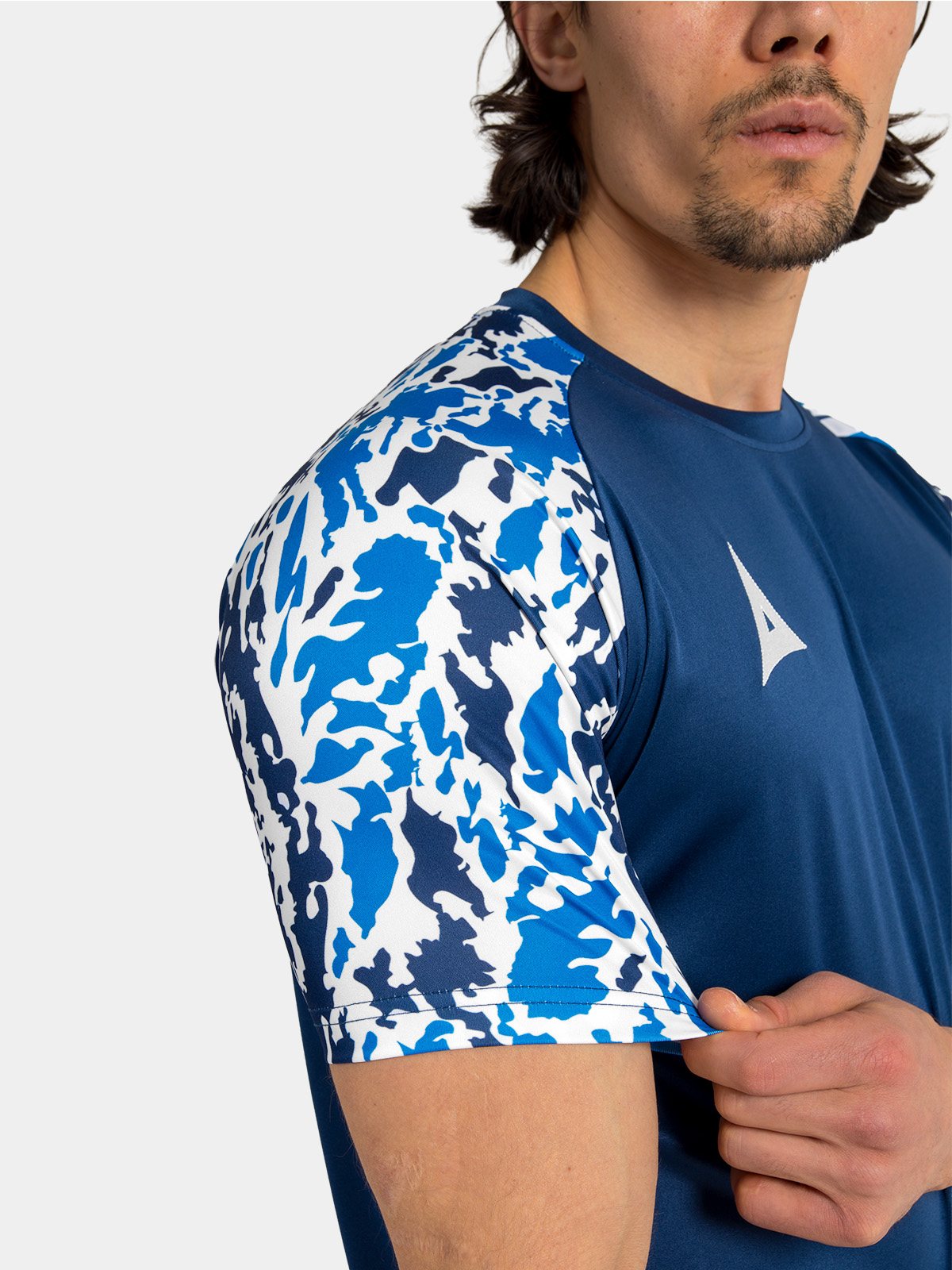 technical detail of the navy & royal blue sublimated camo texture within the sleeve design.