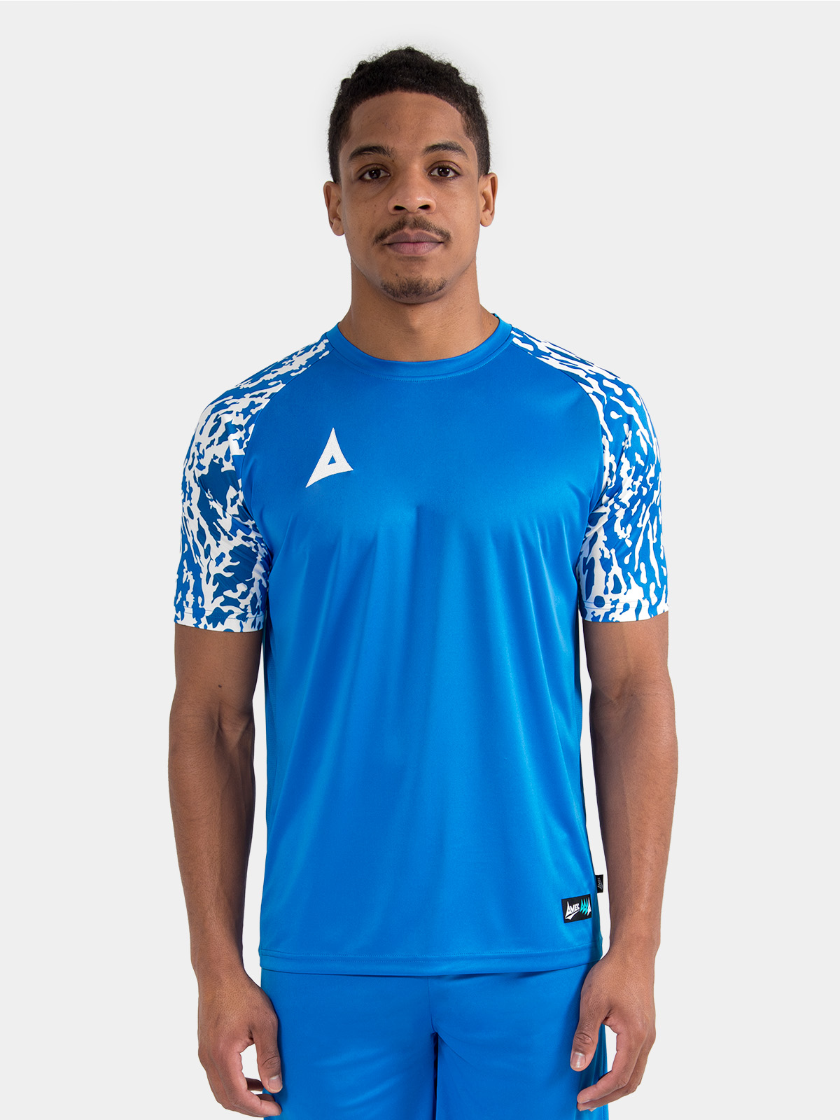 athlete wearing the royal blue classic pro jersey, showcasing the true-to-size athletic cut.