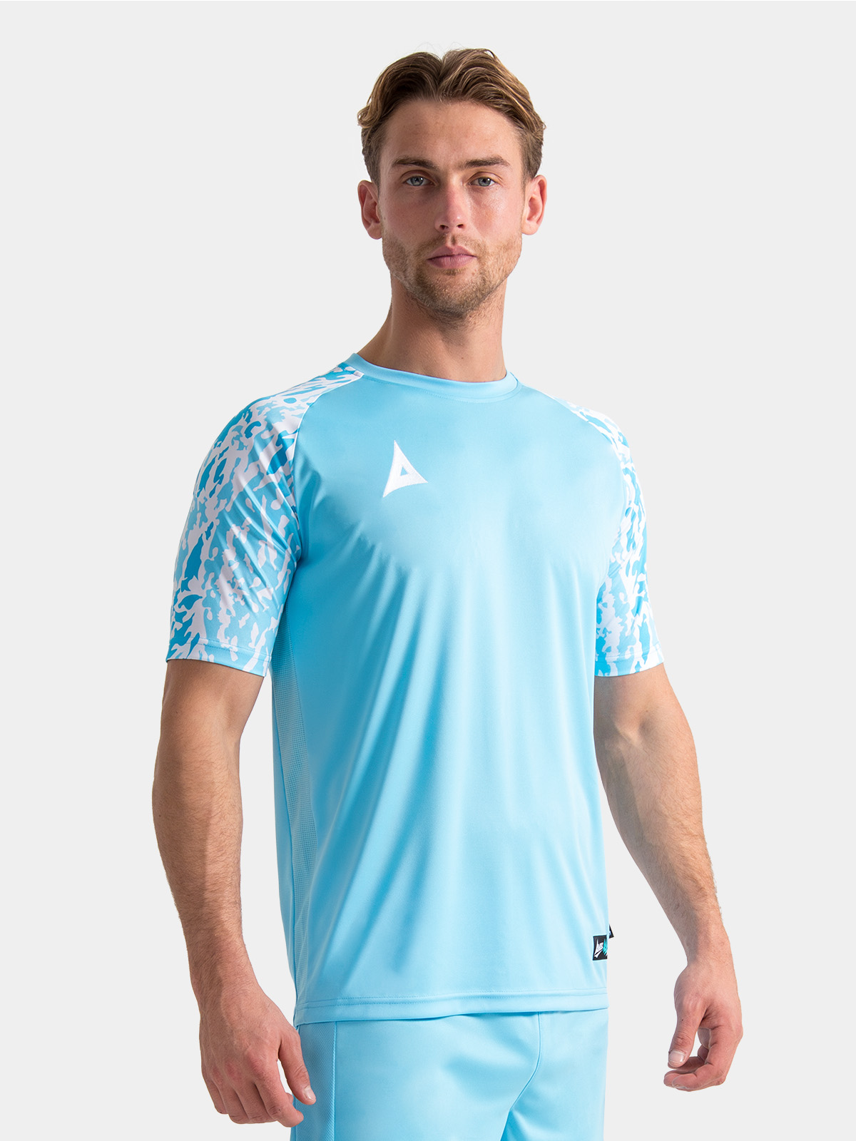 lifestyle shot of a model wearing the hyper sky classic pro jersey, illustrating the modern athletic silhouette.