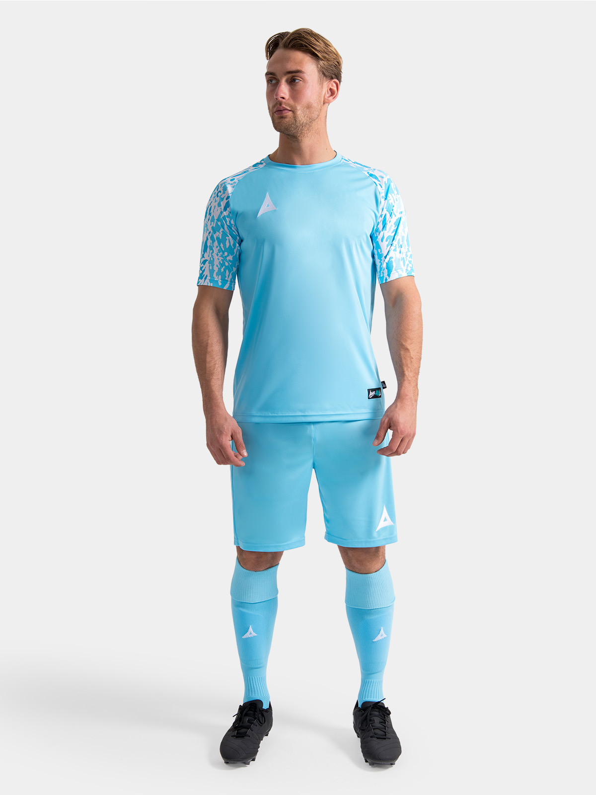 full matchday kit view of the hyper sky jersey on-model, paired with matching professional teamwear shorts and socks.