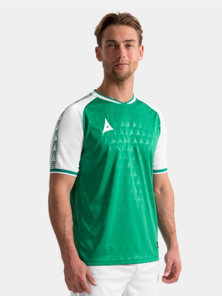 Lifestyle shot of the Green and White Heritage Jersey showing the premium debossed fabric on-model.