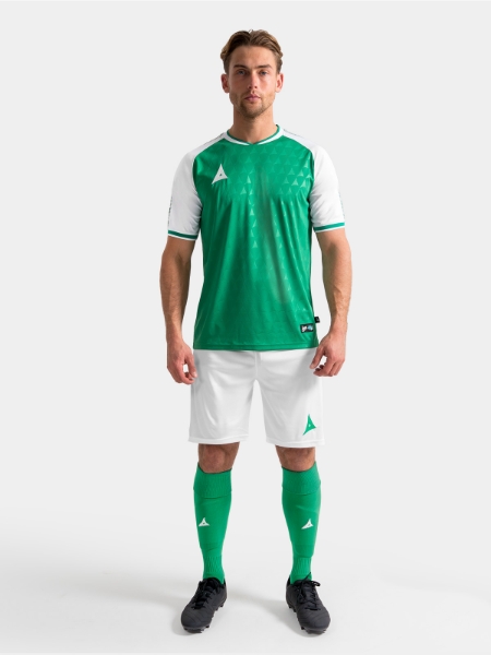 Full body lifestyle view of the Green and White Heritage matchday kit.