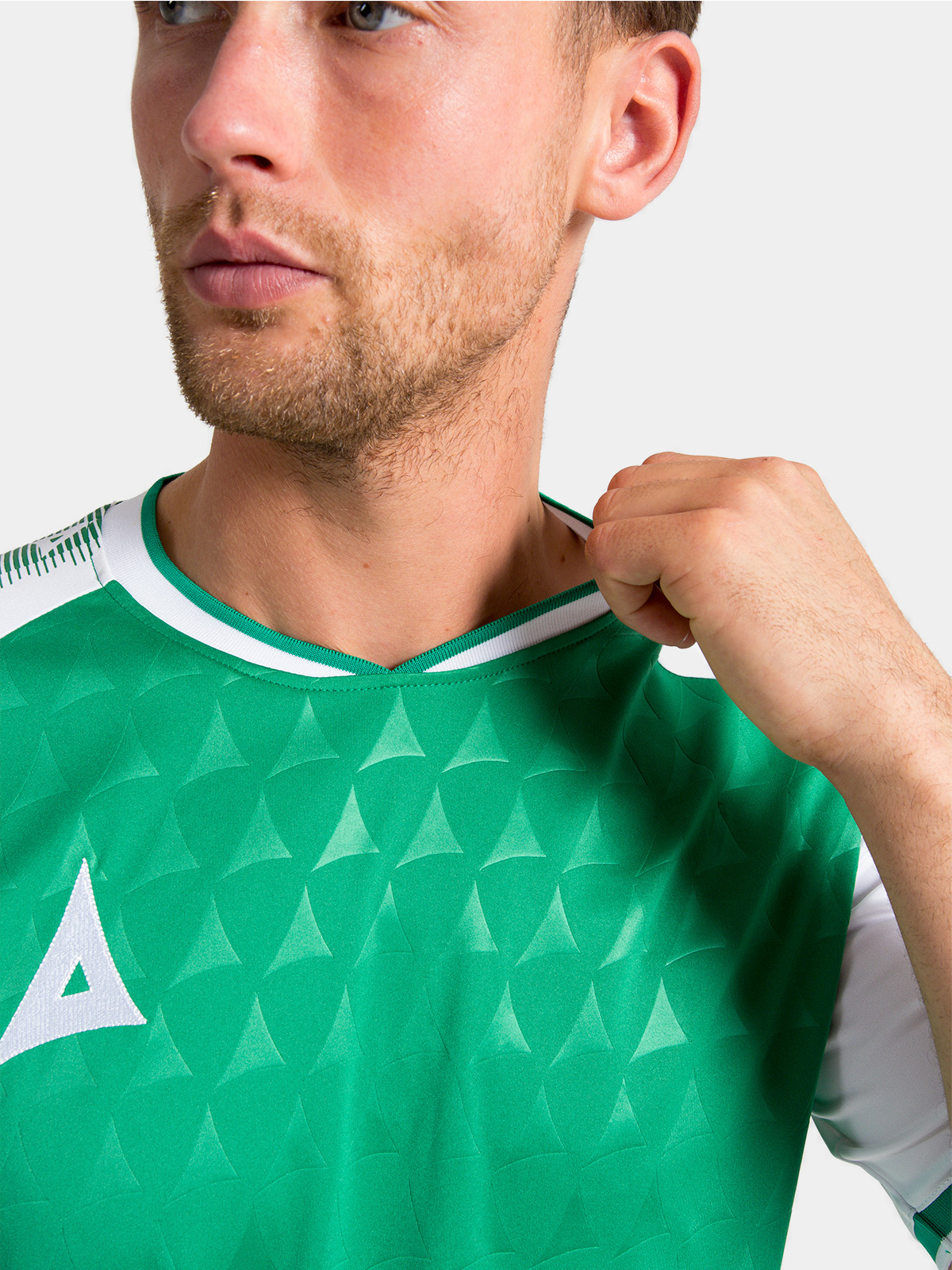 neckline construction of the green and white heritage jersey featuring the soft-feel ribbed collar.