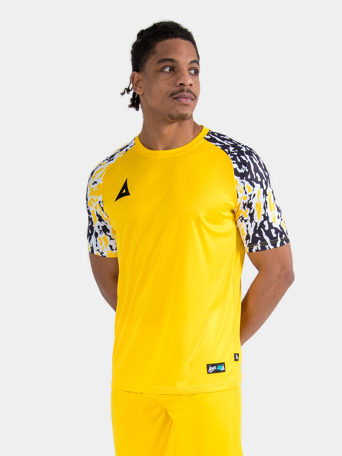 model showcasing the yellow classic pro jersey, highlighting the bold colourway and performance-led pro-fit.