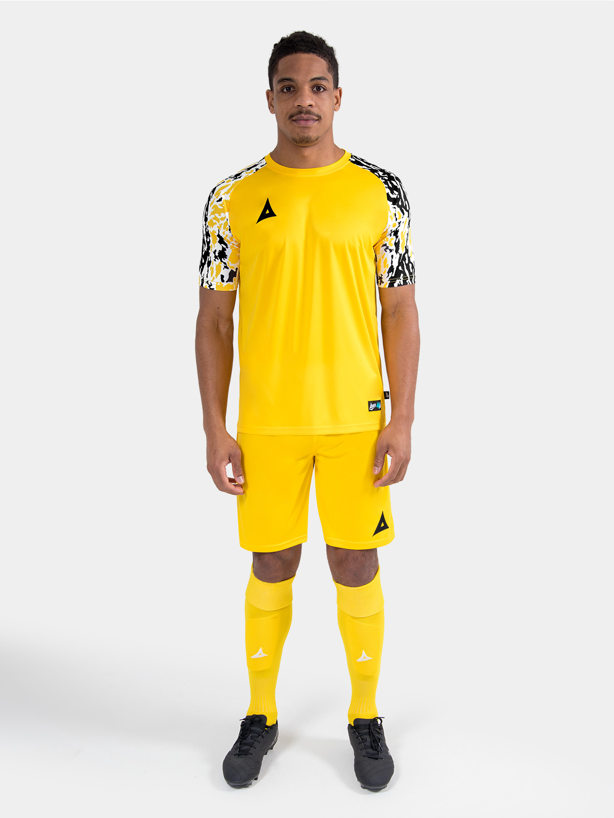 complete yellow matchday kit on-model, demonstrating a unified and professional on-pitch aesthetic.