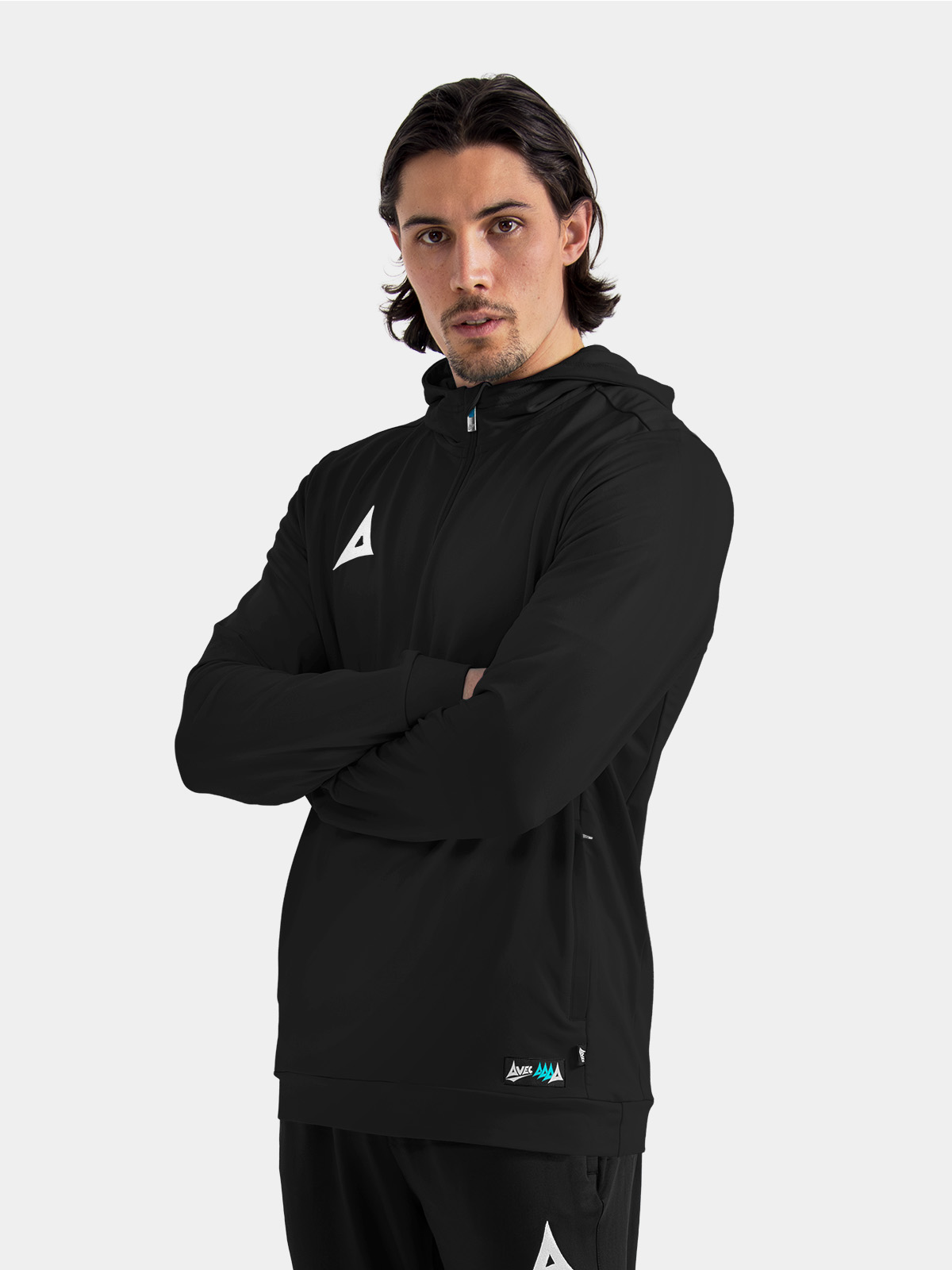 model wearing the black focus 2 qz hoody, illustrating the professional and versatile sideline look.