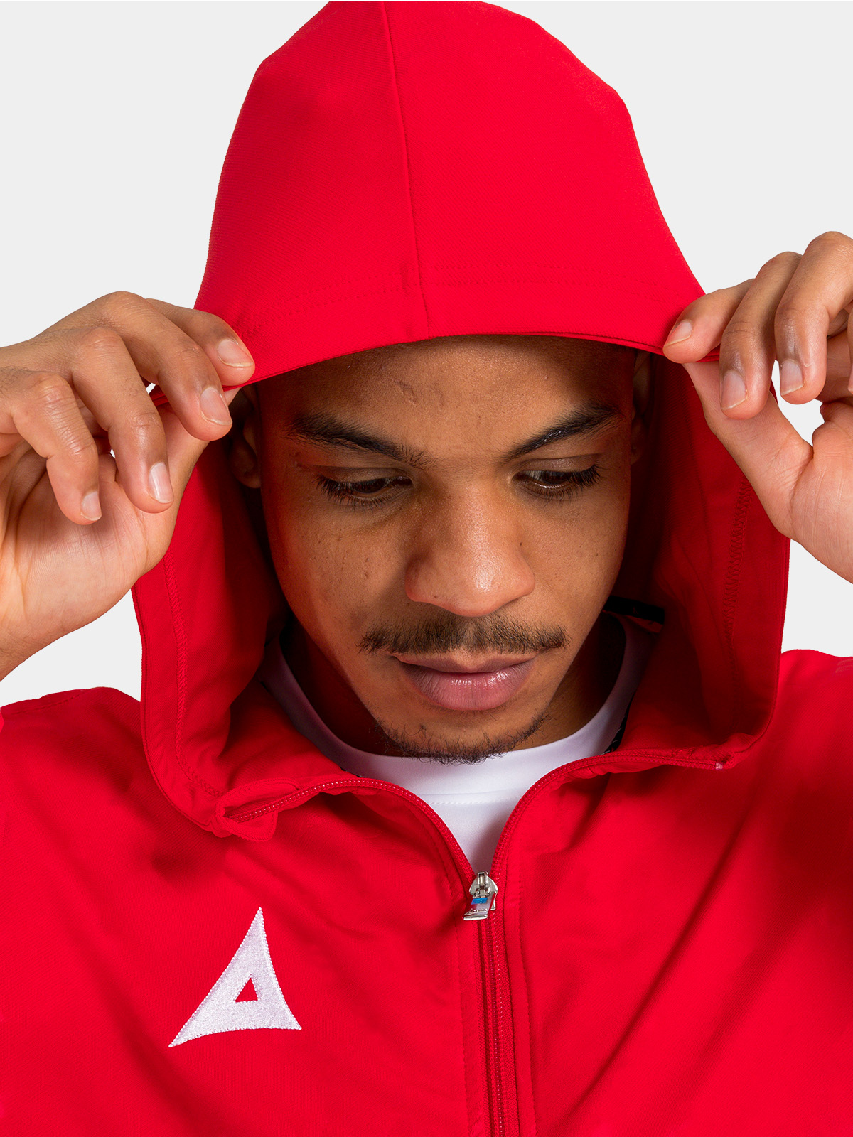 detailed view of the red technical hood, built for warmth and breathability on the training pitch