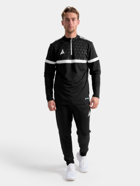 Full-length view of the Black Evolve Pro training kit, featuring the 1/4 zip overlay paired with matching technical tapered trousers.