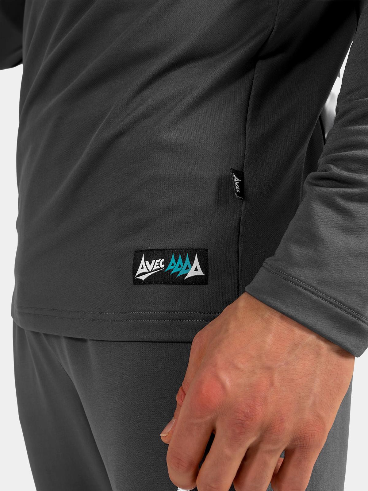 detailed shot of the anthracite sleeve cuff with the athletic thumb-loop engaged, designed for extra hand warmth and stability.