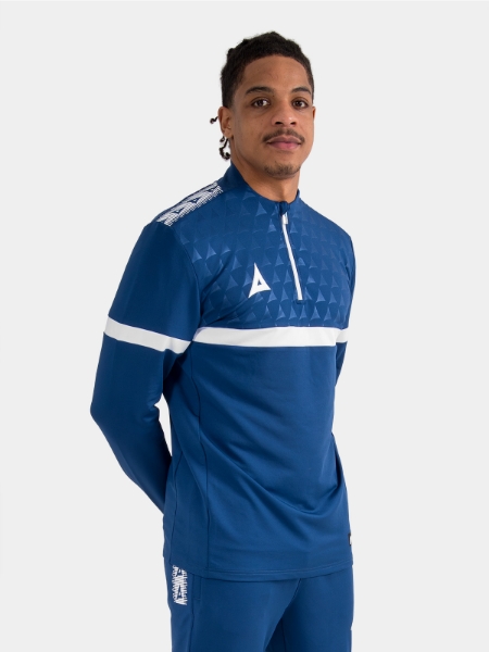 Athlete wearing the Navy Evolve Pro Overlay, highlighting the moisture-wicking fabric and comfortable athletic collar.