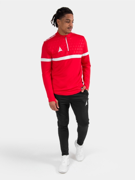 Complete Red Evolve Pro training kit on-model, showcasing the overlay as a bold and functional performance piece