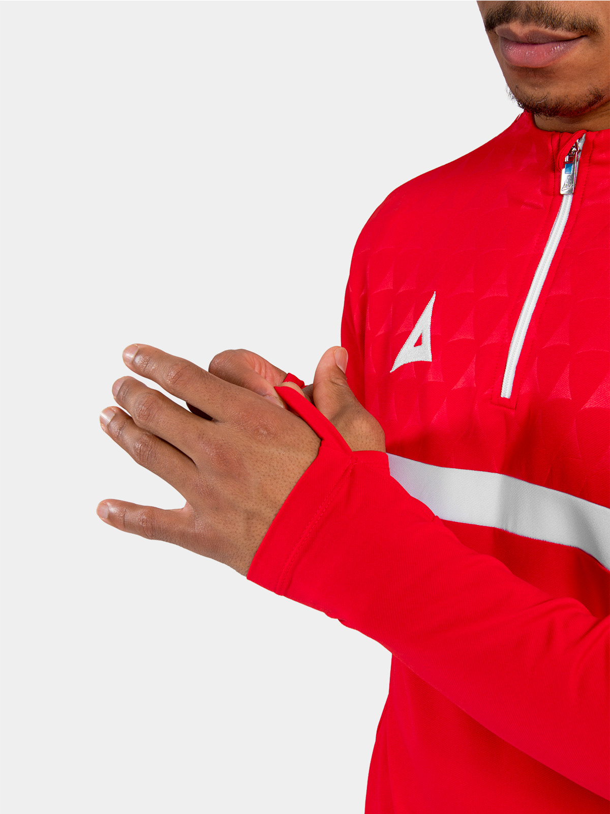 detailed view of the red sleeve cuff featuring the integrated thumb-loop for enhanced hand coverage and fit.