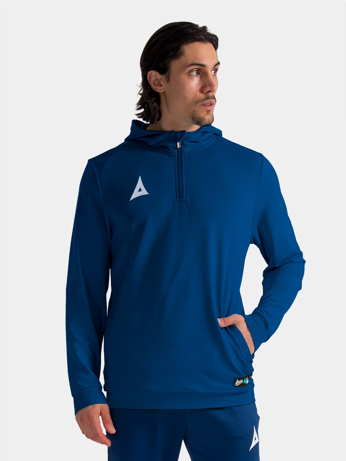 coach wearing the navy focus 2 qz hoody, demonstrating the smart and functional sideline aesthetic.
