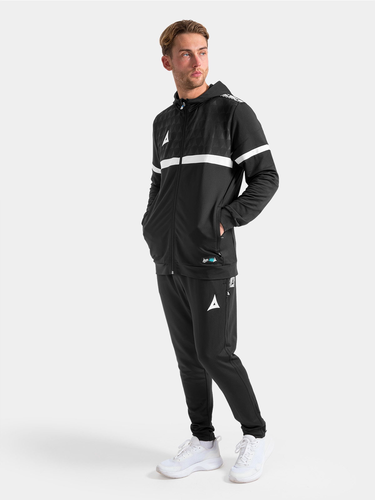 full-length view of the black evolve pro training kit, featuring the full-zip hoody paired with matching technical joggers.