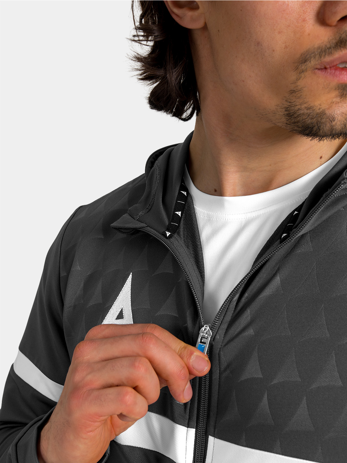 front view of the anthracite hoody fully fastened, showcasing the clean lines and contrast debossed chest panel.