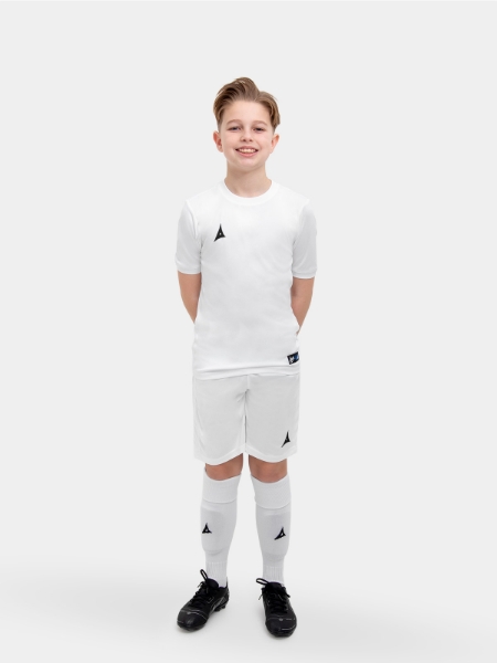 The child in the shoot is wearing a full white kit with matching socks and shorts