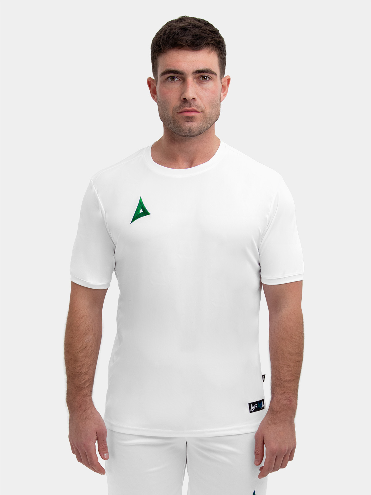 a white shirt with a green logo can be worn with white or green shorts