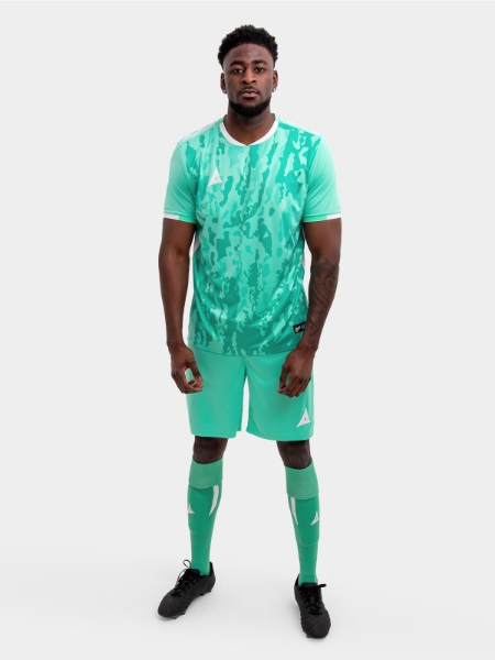 A model standing up wearing a mint green / hyper green Football Training shirt, mint green / hyper green Shorts and mint green / hyper green Football Socks.
