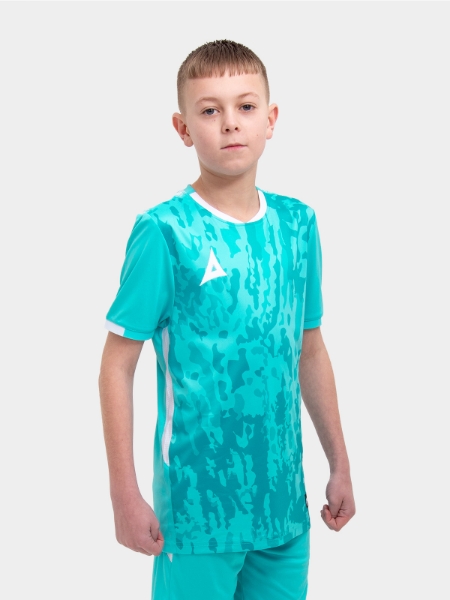A kid standing up wearing a hyper blue football shirt