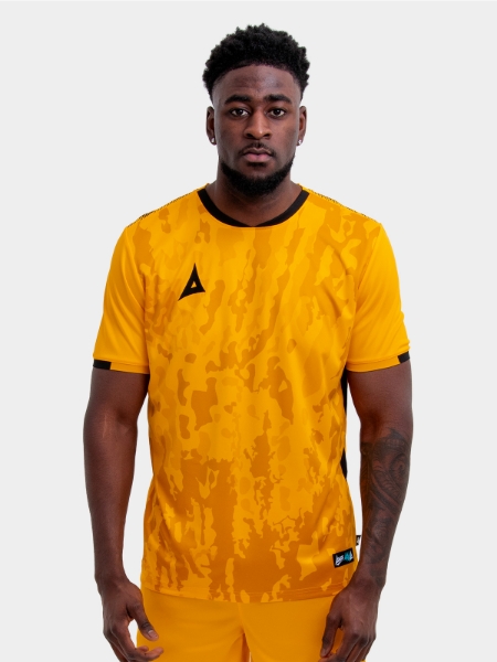 Model wearing an amber and Black Sports football training t-shirt.