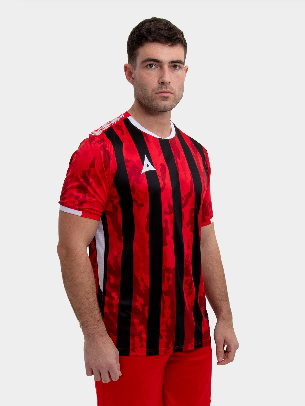 model wearing a red and black stripe sports football training t-shirt.