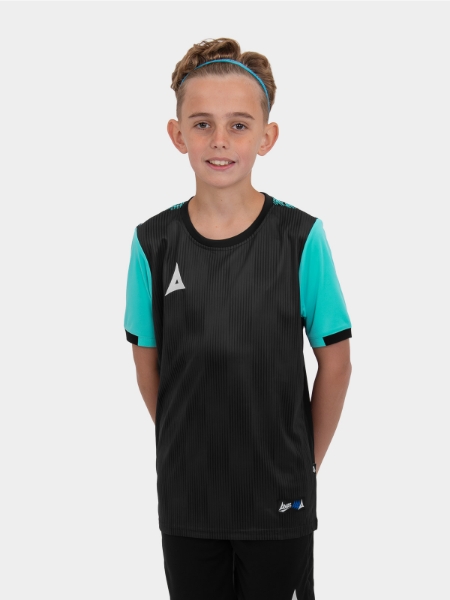 A boy is holding a size 4 football and is wearing a black football shirt with light blue sleeves
