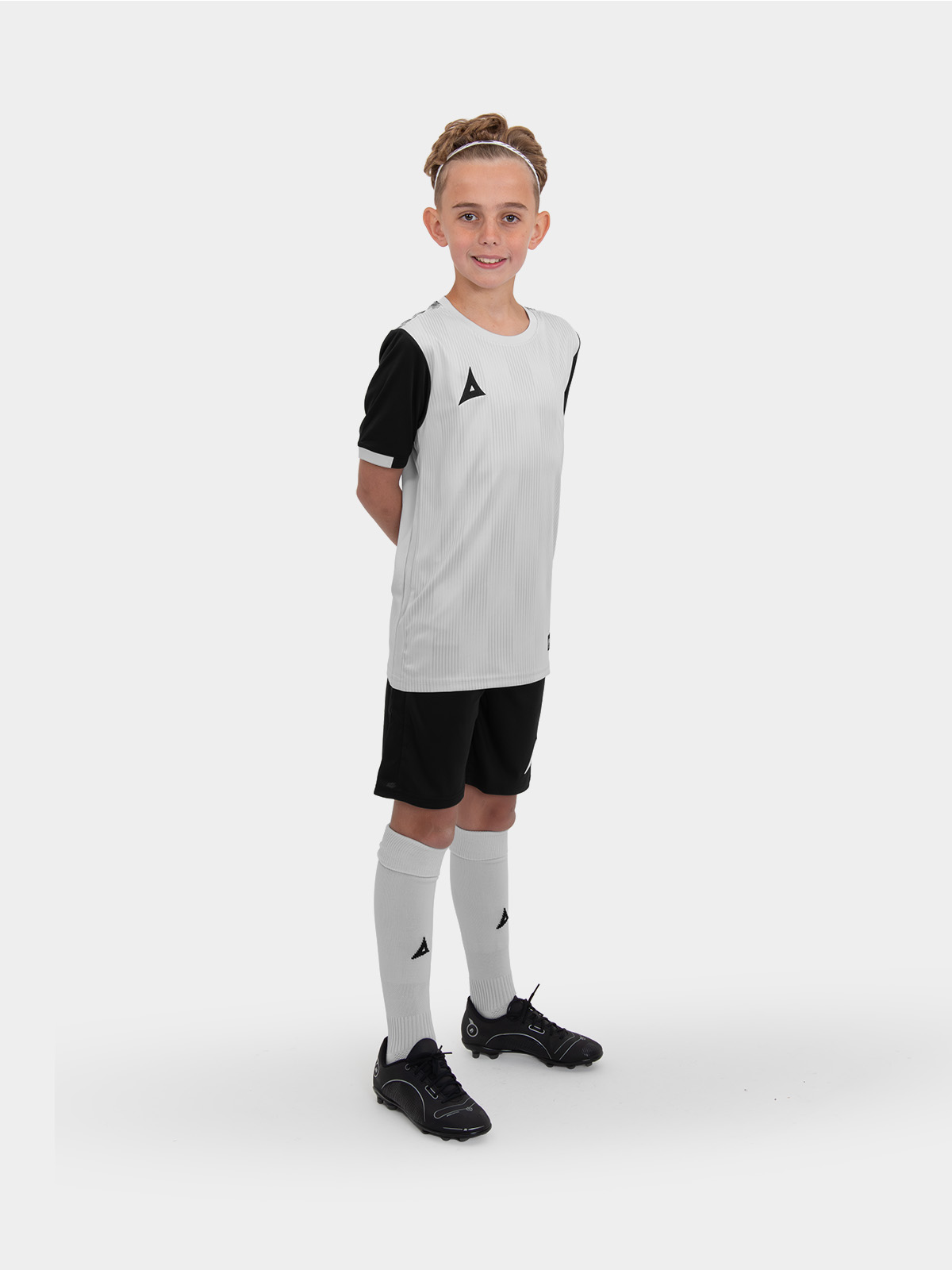 a grey football shirt with black shorts and grey socks makes a winning combination for any kids football team.