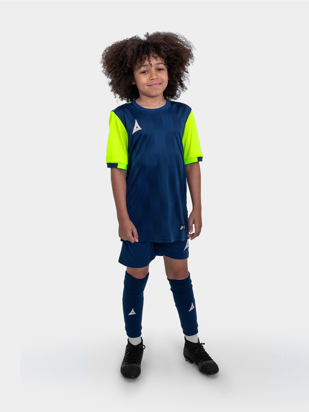 	a kids football kit in navy blue with yellow sleeves