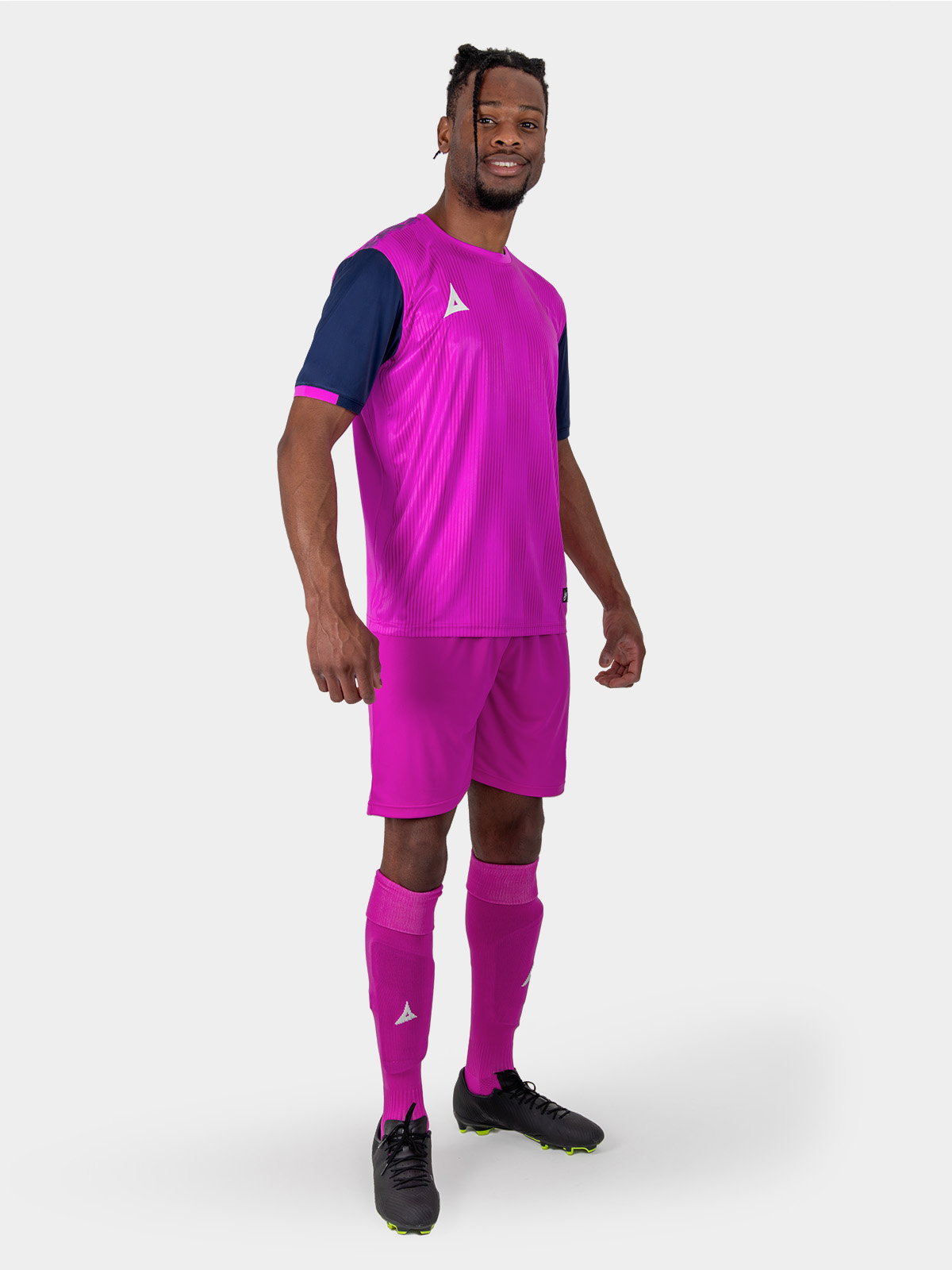 a full magenta football kit with navy sleeves.